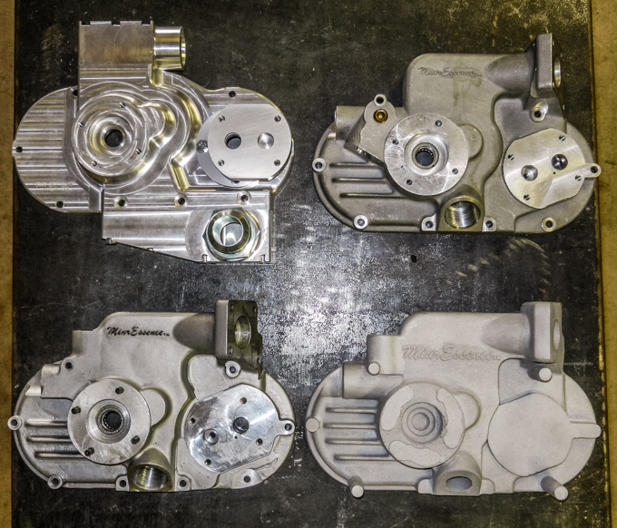 Evolution of a new part.. The upper left hand oil pump piece was machined from a single block of aluminum.  The other three prototypes were cast and then machined from aluminum